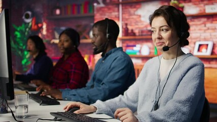 Friendly customer support workers respond to customers inquiries about products or services. Cheerful call center agent in office providing accurate and satisfactory information to customers, camera B