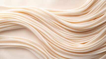 Flowing strands of soft beige fabric texture