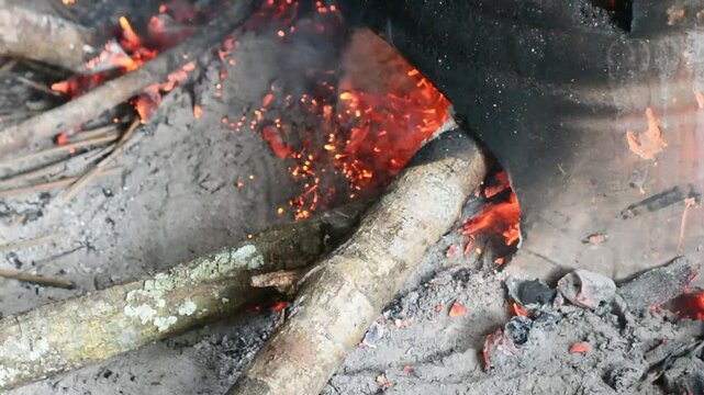 Traditional cooking with a stove made of clay and a hot pot boiling water