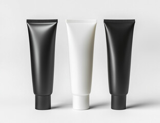 Black, white, and black cosmetic tubes mockup for packaging design.