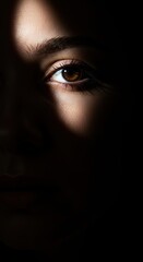 Captivating gaze of a woman in shadows  