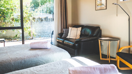 Room interior modern hotel pillows beds chair lounge rolled towel 