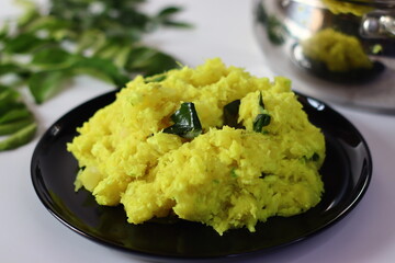Boiled and mashed tapioca, blended with turmeric and garnished with curry leaves