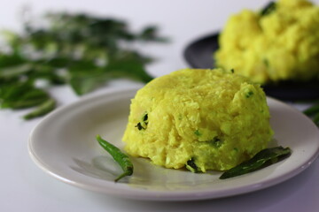Boiled and mashed tapioca, blended with turmeric and garnished with curry leaves