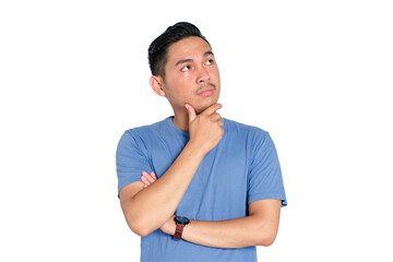 Smiling young Asian man touching chin while looking up with thoughtful expression, decision making,...
