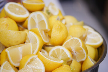 Freshly cut lemons arranged in a bowl for culinary use