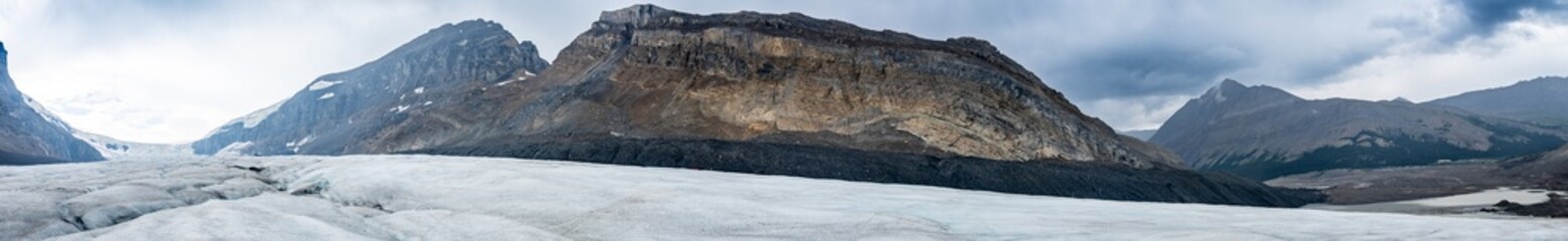 Panoramic View into the Athabasca Glacier in Jasper National Park with cloudy sky