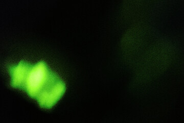 Abstract light green gradient background with wavy grain texture.