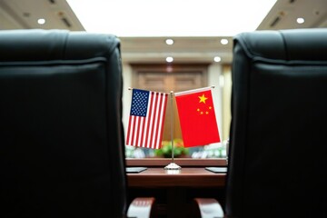 Two flags representing the United States and China stand on a conference table in a formal meeting room setting