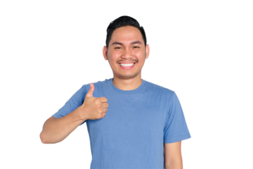 Smiling young Asian man giving thumbs up gesture, wearing blue t-shirt, isolated on transparent background