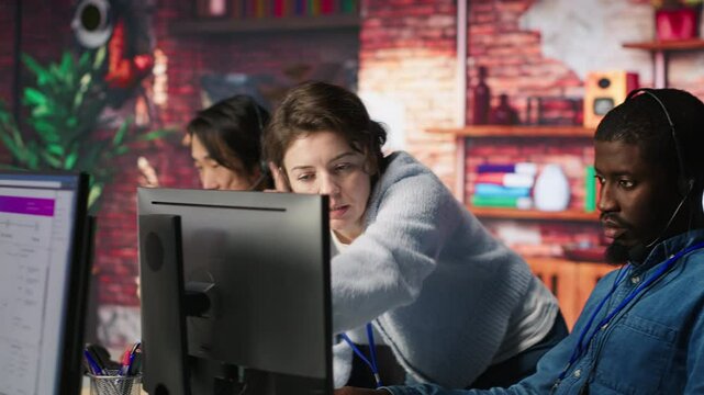 Call center manager teaching intern how to track clients shipment parcels. Customer center team leader doing induction to trainee, locating clients packages and providing status updates, camera A