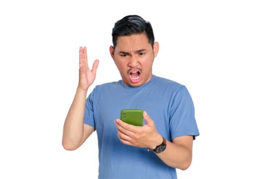 Shocked young Asian man shouting at his smartphone with raised hand, expressing frustration or anger, isolated on transparent background