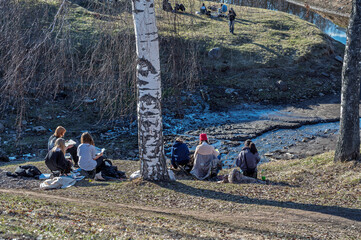 Art school students during an outdoor painting lesson.