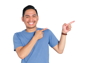Happy young Asian man smiling and pointing to the side with both hands, promoting or presenting product, isolated on transparent background