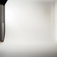 Empty professional studio space with seamless white backdrop and soft lighting