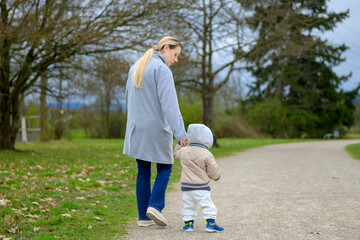 Mother And Son Walking Away