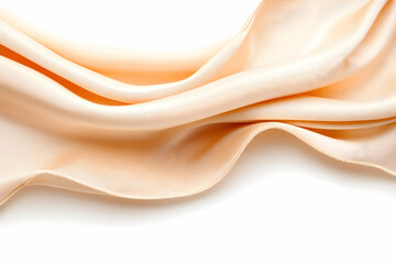 Obraz premium Peach-colored fabric gracefully draped against a white background, showcasing its soft texture and luxurious folds