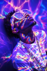 Black man in psychedelic concept shoot with rainbow holographic light patterns on reflective surfaces