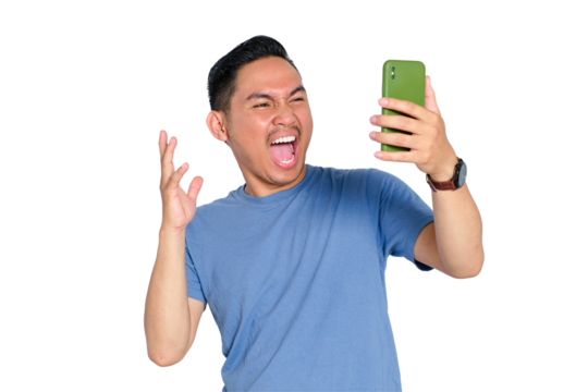 Excited young Asian man shouting while looking at his smartphone during video call, celebrating good news, isolated on transparent background