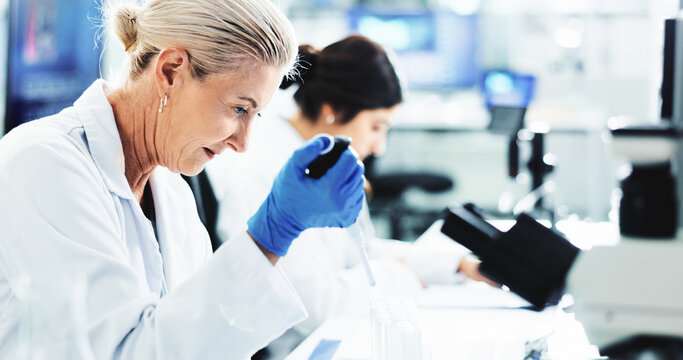 Woman, scientist and tests with vial for clinical trial, medical discovery or exam at laboratory. Female person, doctor or forensic research with pipette for DNA, science or health sample at lab