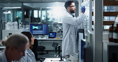 Glass wall, science and writing with people in laboratory for equation, formula or solution....