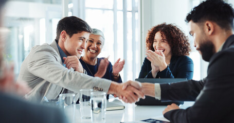 Happy, business people and applause with handshake for agreement, good deal or partnership at...