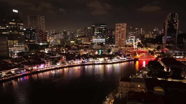 Boat Quay historical area in Singapore at night. Aerial
