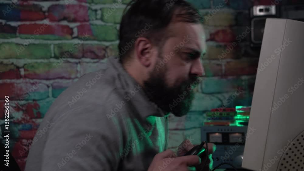 Poster addicted video gamer from 1990's playing video game on desktop computer with gaming console