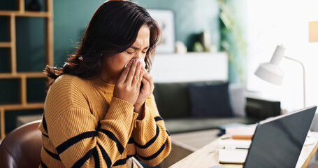 Sick woman, laptop and blowing nose with tissue for flu, cold or viral infection at home. Female...
