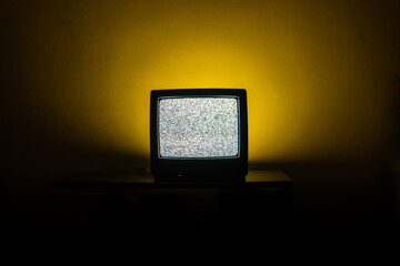 Old TV in a dark room turned on without image