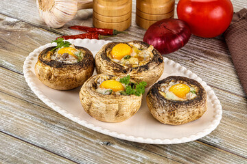 Baked champignon with quail egg
