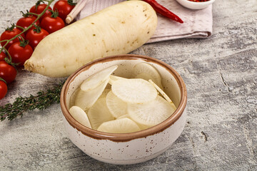 Sliced white daikon radish in the bowl