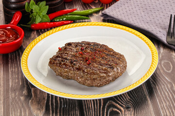 Grilled beef burger cutlet with sauce