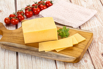 Yellow cheese piece with slices