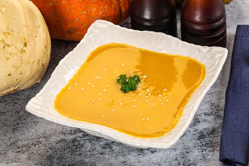 Vegan pumpkin cream soup served sesam