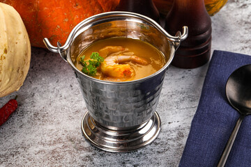 Pumpkin cream soup with prawns