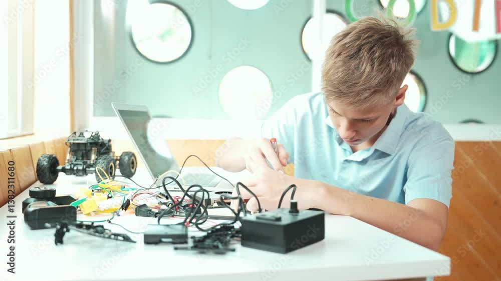 Poster caucasian boy fixing main board while study construction by using laptop analysis data. young techni