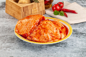 Raw chicken marinated thighs with skin