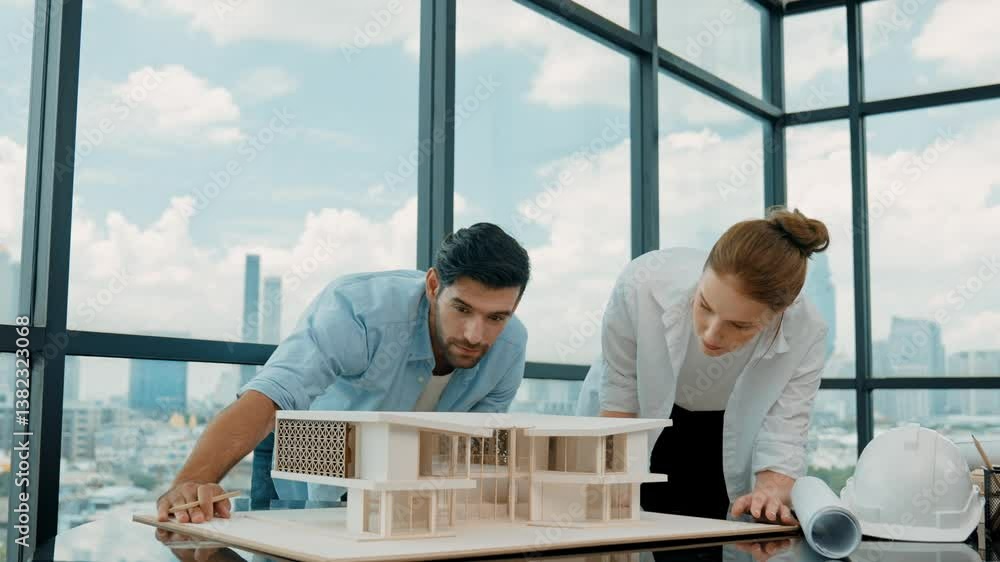 Poster skilled project manager pointing architectural model by using pencil while professional cooperative 