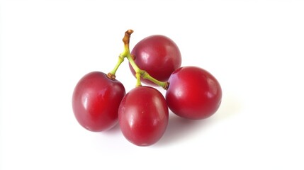 Obraz premium Fresh red grapes resting on a white background showcasing their glossy skin and plump shape, highlighting their natural appeal and vibrant color, isolated on white background