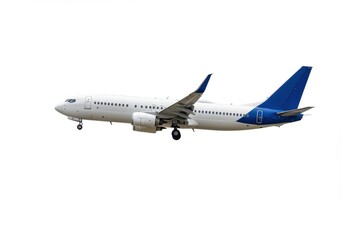 Obraz premium A white and blue passenger airplane isolated on a plain white background in a side view shot