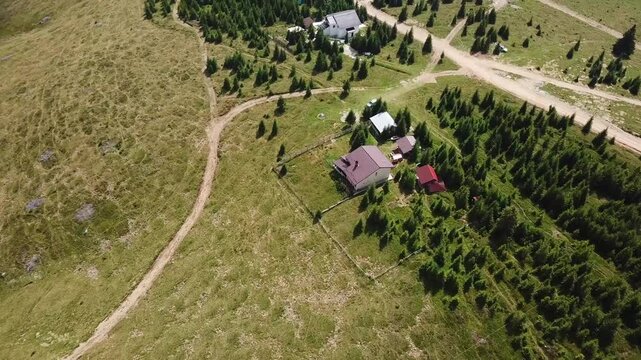 View from Snezhanka Tower, Rhodope Mountains, in summer, a house nestled in a green forest