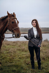 Fototapeta premium A person standing next to a horse