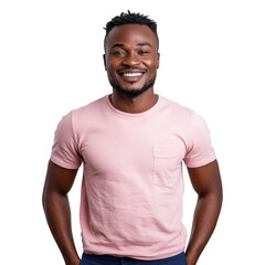 A smiling man with a pink shirt posing against a black background with his hands in his pockets