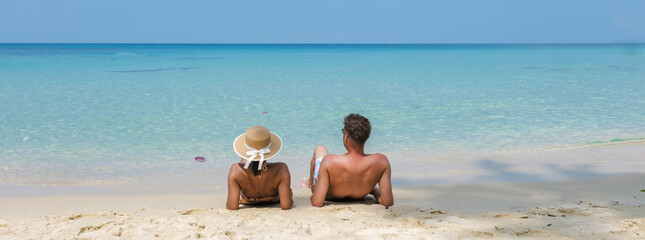 A couple enjoys a serene day on Koh Kood Island Thailand beautiful beaches, basking in the suna perfect setting for travel lovers and romantics, creating unforgettable memories together