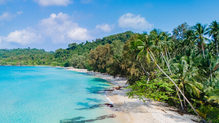 The stunning and breathtaking coastline of Koh Kood Island in Thailand wonderfully showcases its turquoise waters, lush greenery, and a pristine beach paradise, perfect for holiday getaways