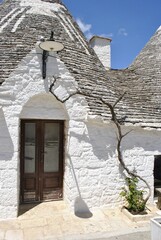 Traditional white Trulli house exterior in Puglia Italy