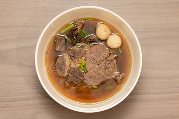 Savory beef noodle soup local kitchen food photography indoor aesthetic presentation