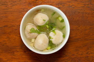 Delicious meatballs in broth capturing warm culinary moments