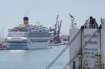 Modern family cruiseship Favolosa sail away departure with other cruise ship liners in port of...